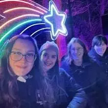 selfie with neon light behind