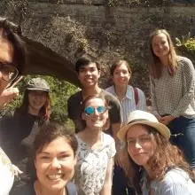 Picture of members of the lab standing in front of a bridge