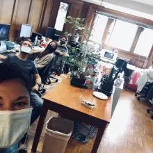 Lab members in the office with Flo in the foreground